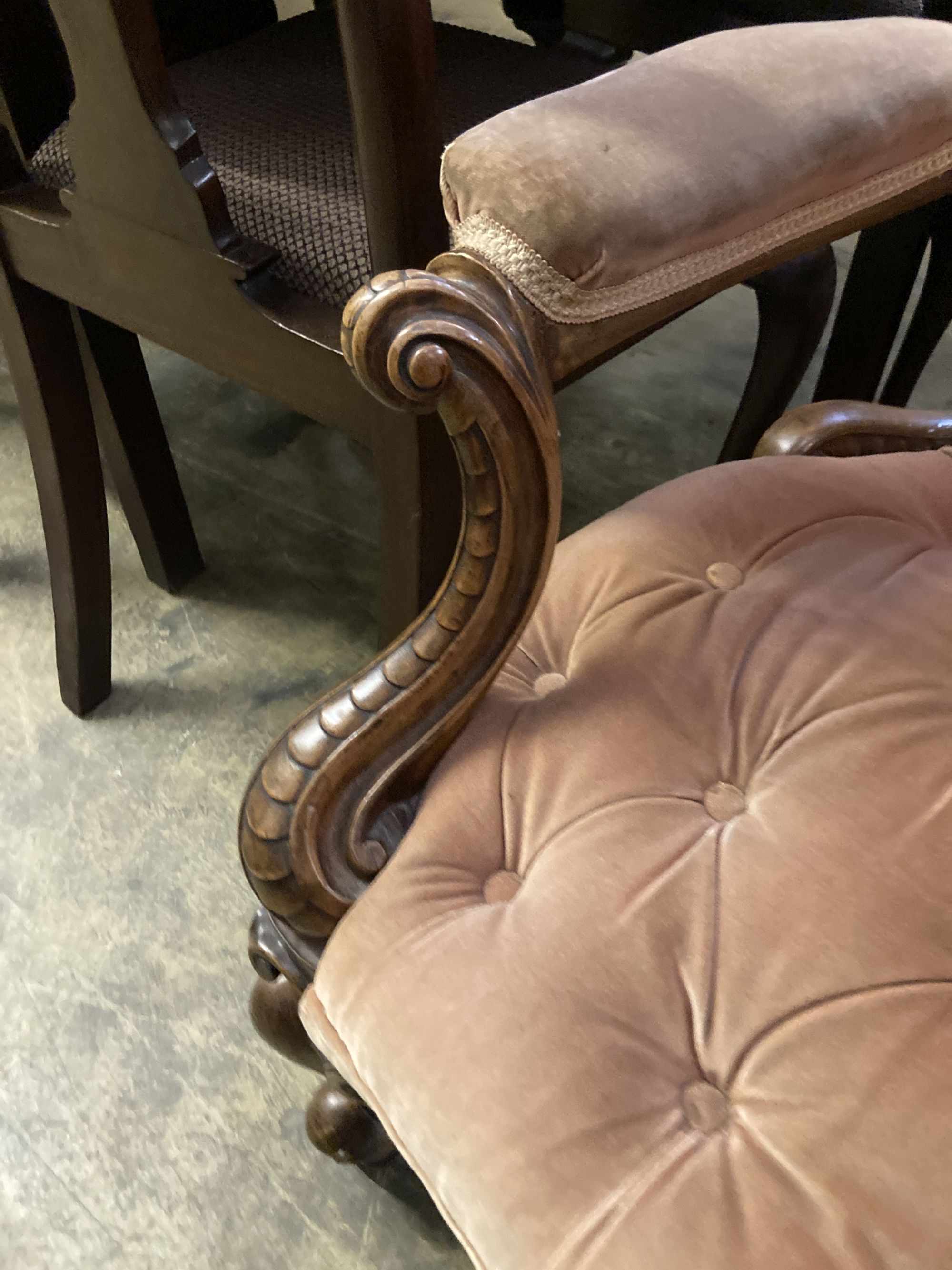 A Victorian carved walnut upholstered spoon back armchair, width 75cm, depth 70cm, height 102cm
